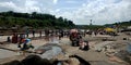 Indian people crowd around river bank