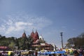 Indian people drive car and ride and bike and walk on street with traffic road at Hindu Shrine and red fort at India Royalty Free Stock Photo