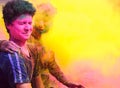 Indian People playing with colorful gulal on Holi.