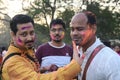 Indian people playing holi with colors and gulal in a ground Royalty Free Stock Photo