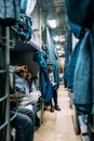 Indian people sitting in their seat with curtain while air condition sleeping train moving from Howrah Junction railway station.