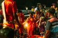 Indian people take merit of fire on their hands in Varanasi Ganga Aarti at holy Dasaswamedh Ghat, near Kashi Vishwanath Temple.