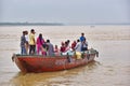 Indian people and tourists on boats for tour on Ganges