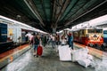 Indian people waiting for the train on platform for traveling and sending goods inside Howrah Junction railway station in Kolkata Royalty Free Stock Photo