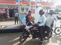 Indian peoples filling petrol in petrol pump on custmers day.