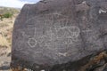 Indian petroglyphs on a gray rock in Idaho