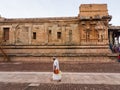 An Indian pilgrim walking in the ancient Chola era Hindu temple of Brihadeeswara aka