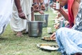 Indian pilgrims are going to eat sacred food called Prasadam - this is an important part of the ritual of worship of the