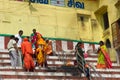 Indian pilgrims on the steps of the sacred bath Royalty Free Stock Photo