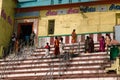 Indian pilgrims on the steps of the sacred bath