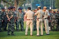 Indian police and military detachment await orders from higher authorities as military units