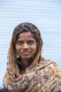 Indian poor girl on the street market in mountain village Leh, Ladakh region, north India, close up Royalty Free Stock Photo