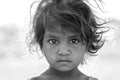Indian poor girl on time Pushkar Camel Mela, Rajasthan, India, closeup portrait. Black and white