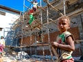 an indian poor kid standing on building construction site during work in India January 2020 Royalty Free Stock Photo