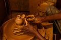 Indian potter making clay pots on pottery wheel in Pottery town is old place. Bangalore. India Royalty Free Stock Photo