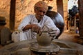 Indian potter at work. Handwork craft from Shilpagram, Udaipur, Rajasthan, India Royalty Free Stock Photo