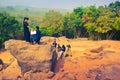 Indian professional photographers taking picture of happy moment of making wedding proposal