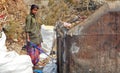 Indian rag pickers search for recyclable material in the garbage collection center on