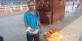 An indian railway food vendor selling samosa in station