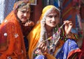 Indian Rajasthani gypsy women in traditional clothes selling beads at local market, Rajasthan state, India