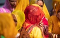 Indian Rajasthani Women in Colorful Dress Red And yellow under Duppata