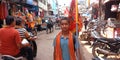 an indian religious boy standing on road holded lord durga flag on hand in india oct 2019