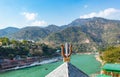 Indian religious symbol trishul with mountain and blue sky background