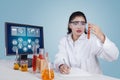 Indian researcher looking at test tube Royalty Free Stock Photo