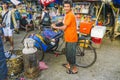 indian rickshaw driver looks for passengers in the old part of New Delhi