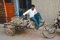 Indian rickshaw man sits on his vehicle. 23 february 2018 Madurai, India