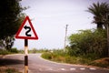 Indian road cautionary sign indicating s curve bend ahead. Sign indicating s bend