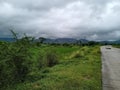 Indian Road near Green fields & small Hills with cloudy