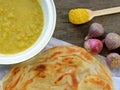 Indian Roti Prata with Chicken Meat and Curry Sauce Closeup Royalty Free Stock Photo