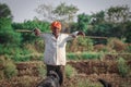 Indian rural men herding flock of sheep Royalty Free Stock Photo