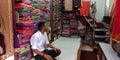 an indian saari seller seating inside the showroom in india oct 2019