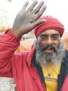 An Indian sadhu in front of the Gangasagar transit camp standing for devotees with a blessing mood