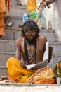 Indian Sadhu reading news paper