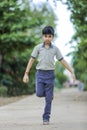 Indian school boy playing hop-scotch in playground Royalty Free Stock Photo