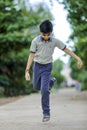 Indian school boy playing hop-scotch in playground Royalty Free Stock Photo