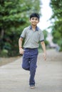 Indian school boy playing hop-scotch in playground Royalty Free Stock Photo