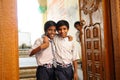 Indian school boys smiling at the school gate