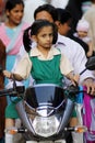 Indian school girl on a scooter