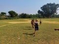 Indian school girls running on barefoot on the field. they practice for the annual sports