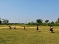 Indian school girls running on barefoot on the field. they practice for the annual sports