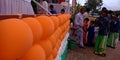 Indian school teacher monitoring school kids during an Independence Day program