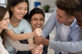 Indian schoolgirl and classmates put fists on each other laughing