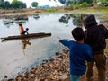 indian children studying at open area class village about laptop system in India January 1, 2020