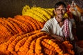 Indian seller with flower garland on Flower market at Mallick Ghat in Kolkata. India Royalty Free Stock Photo