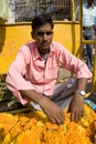 Indian seller of flowers.