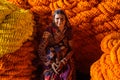 Indian seller woman with flower garland on Flower market at Mallick Ghat in Kolkata. India Royalty Free Stock Photo